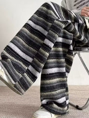 Men's wide-leg knit pants with a striped pattern in gray and black.