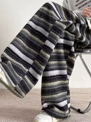 Men's wide-leg knit pants with a striped pattern in gray and black.