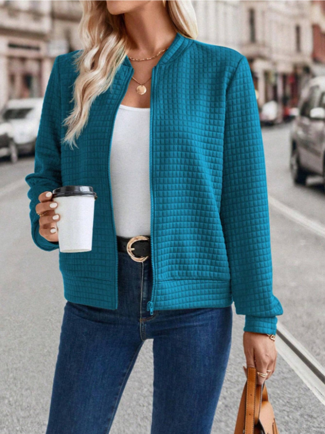 Quilted bomber jacket in French Blue with zip closure and crew neck.