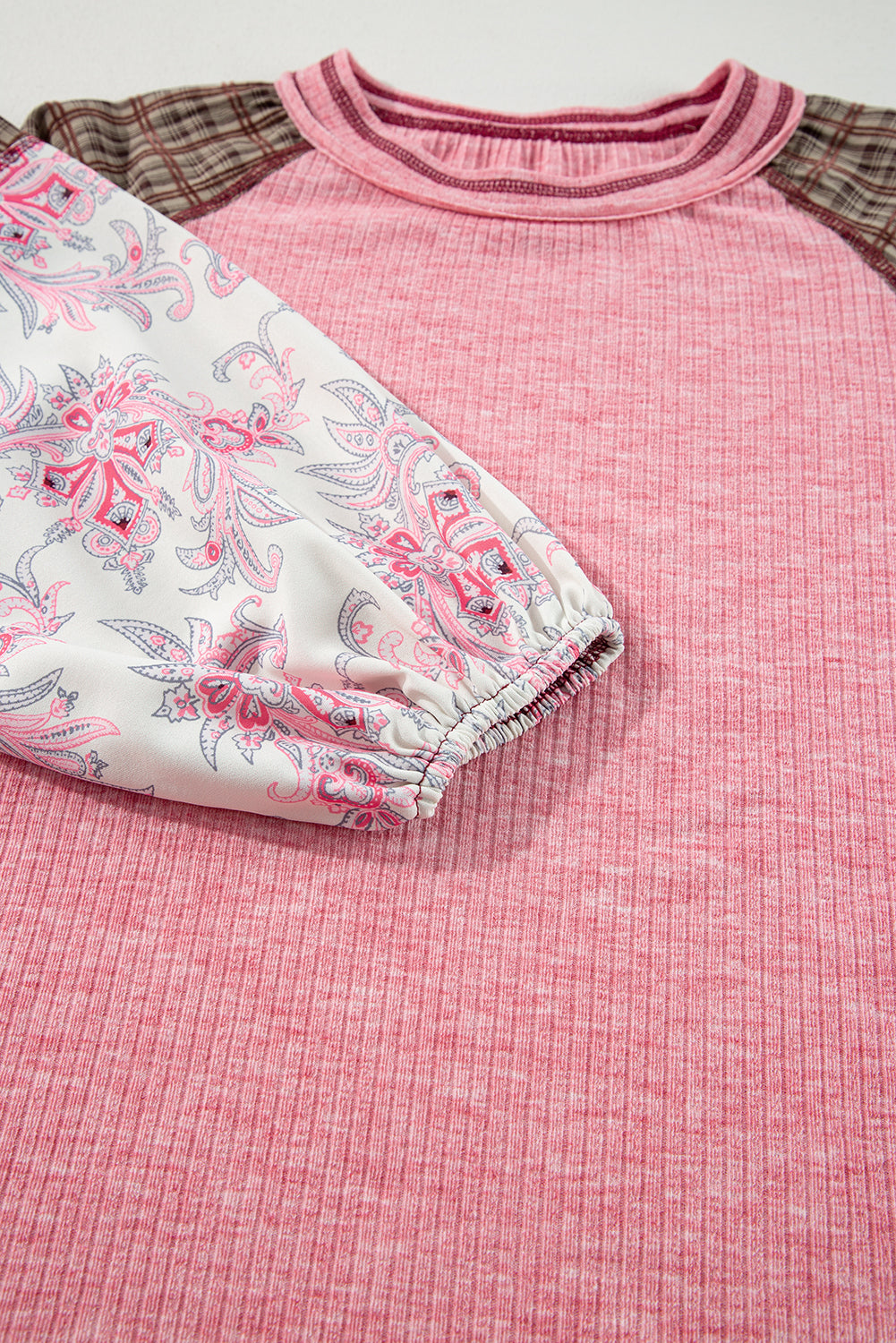 Paisley puff sleeve raglan tee in dusty pink with contrast plaid sleeves and crew neck.
