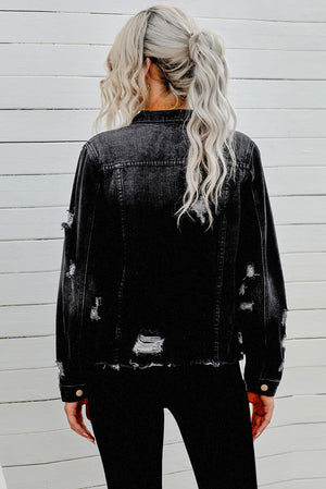 Black distressed denim trucker jacket with frayed edges and ripped details.