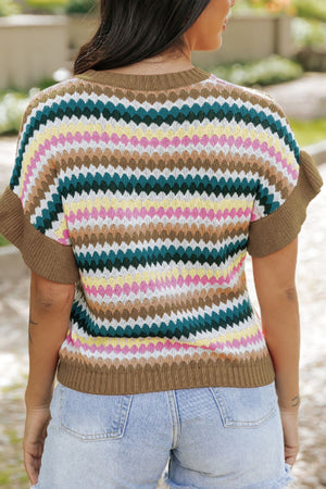 Textured knit sweater with chevron stripes in multicolor and contrast brown trim.