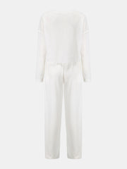 White waffle knit cropped lounge set with long sleeves and wide-leg pants.
