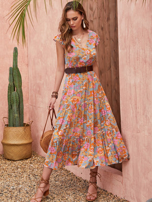 Bohemian floral tiered midi dress with flutter sleeves and V-neck in multicolor.