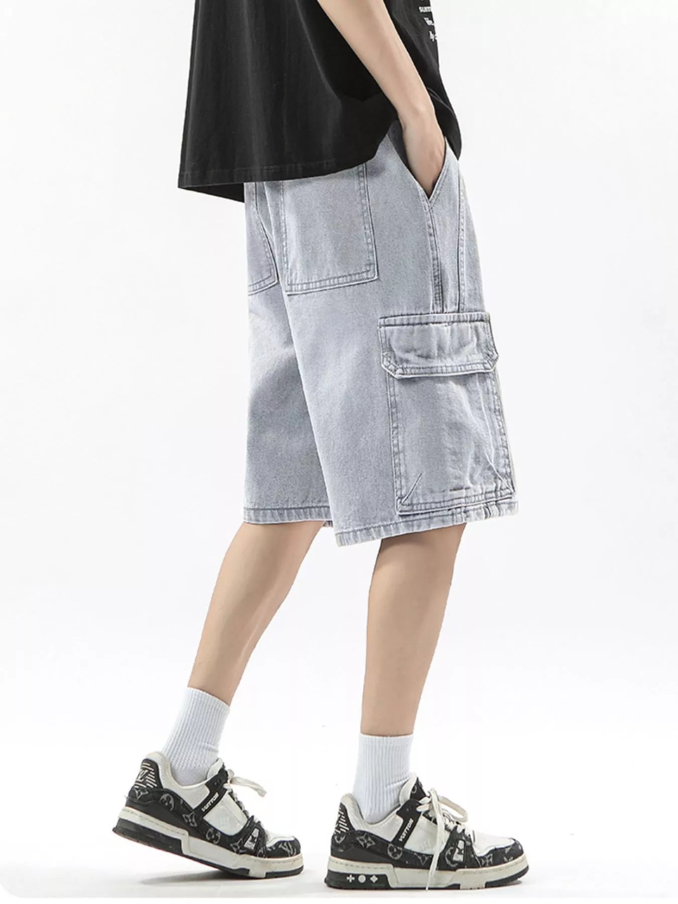 Men's light wash denim cargo shorts with drawstring waist and multiple pockets.