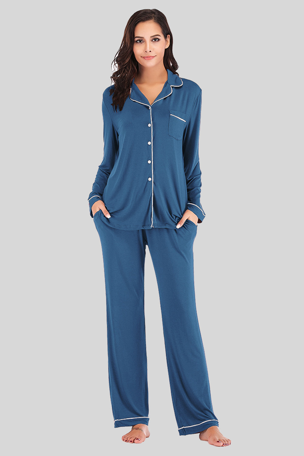 Piped trimmed pajama set in French Blue with long sleeves, button front, chest pocket, and pants with pockets.