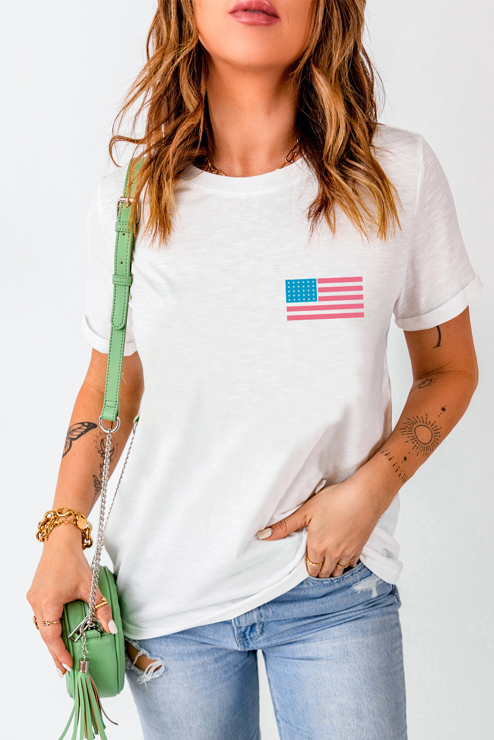 White cotton t-shirt with a small American flag graphic on the chest.
