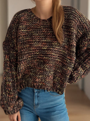 Textured knit sweater with balloon sleeves in a multi-color brown, pink, and yellow yarn.