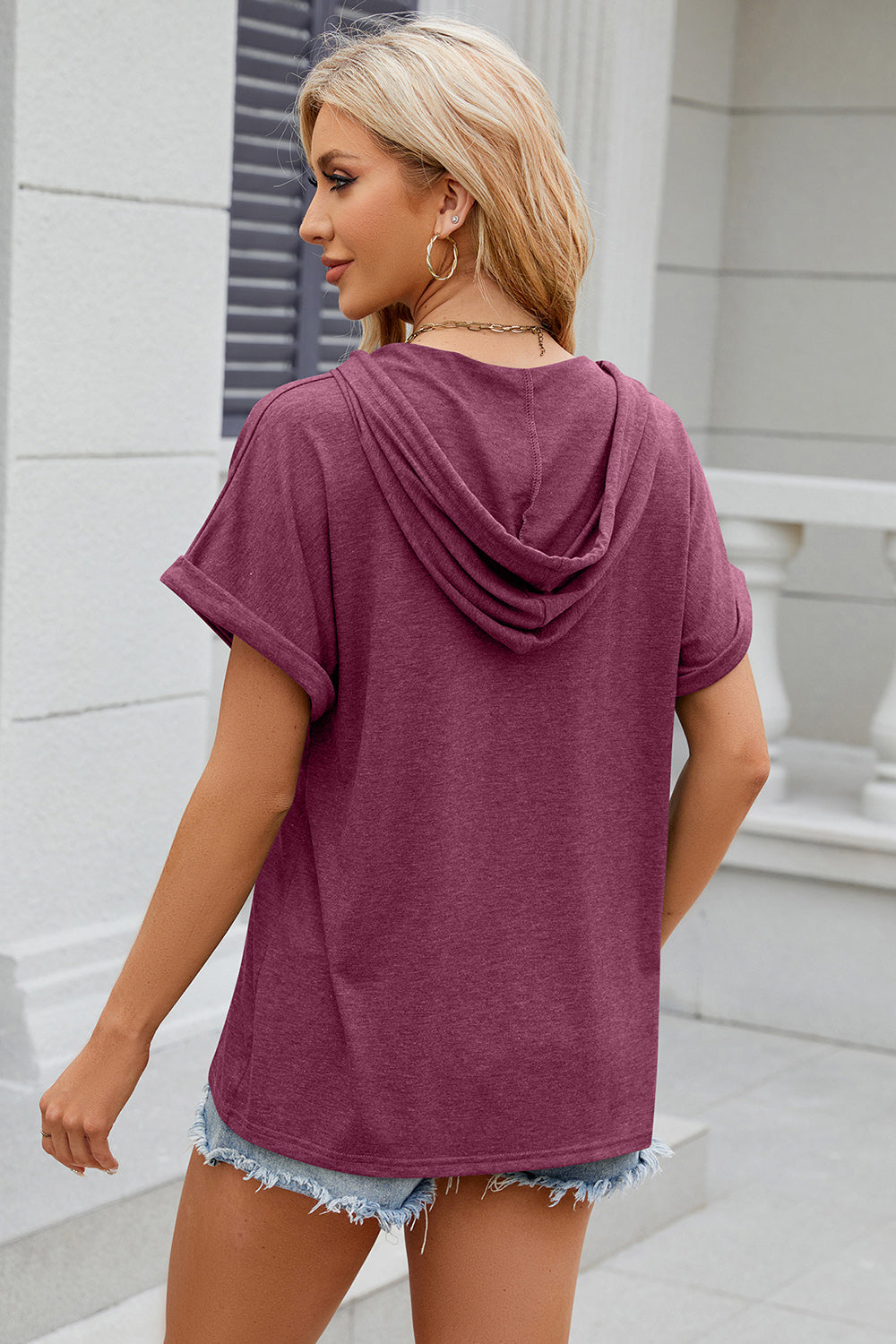 Henley hooded tee in Red-Violet with rolled short sleeves and a casual fit.