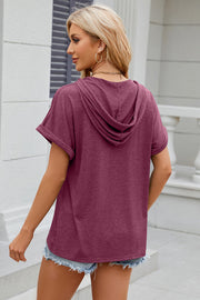 Henley hooded tee in Red-Violet with rolled short sleeves and a casual fit.