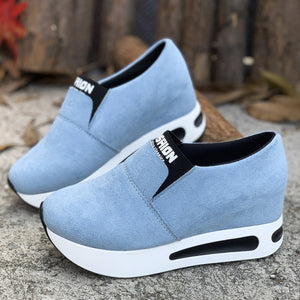 Sky blue round toe platform slip-on sneakers with white soles and black accents.