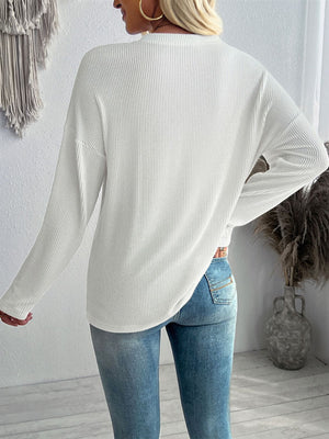 Textured slouchy pocket tee in white with long sleeves and a relaxed fit.