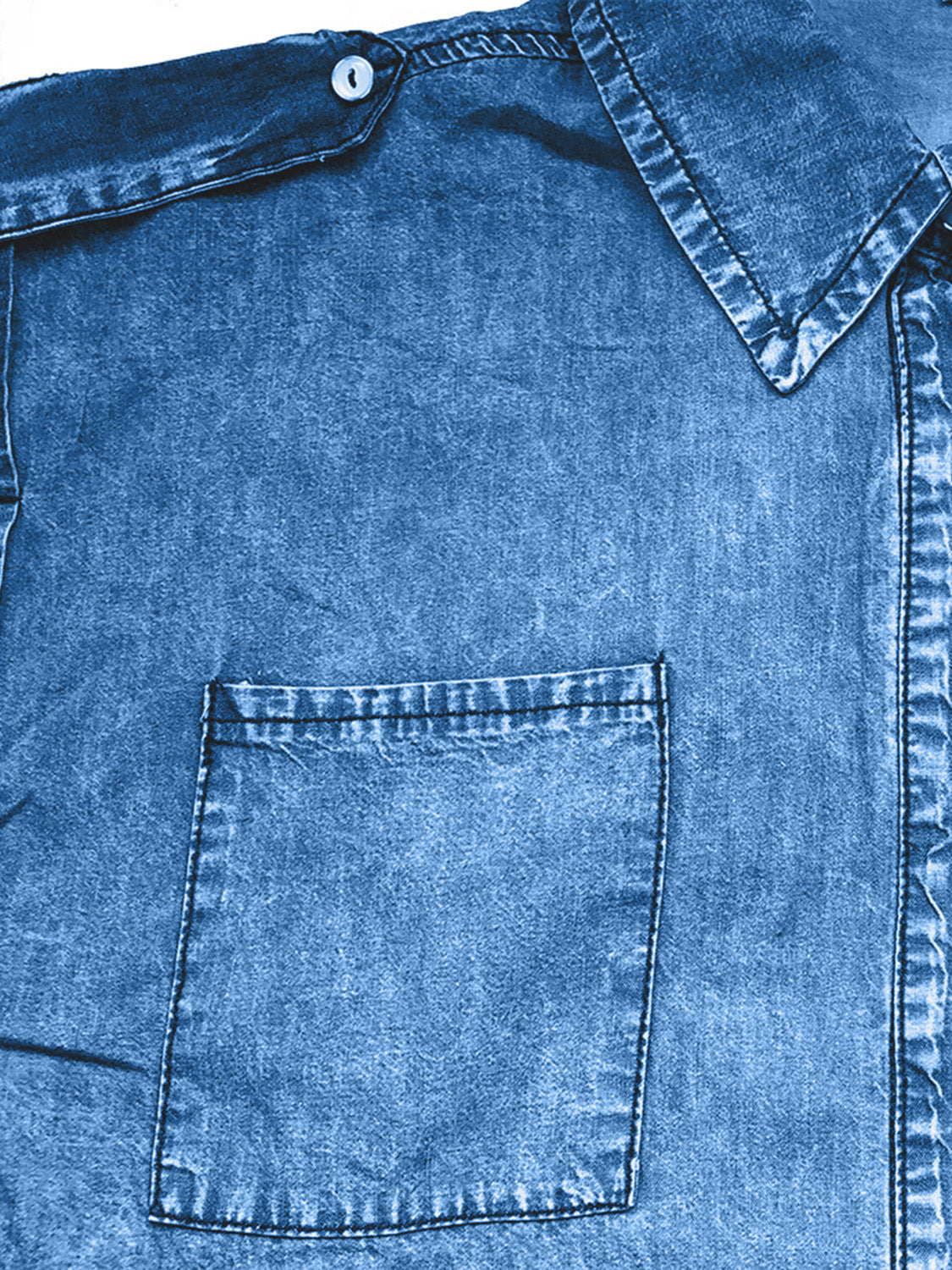 Sleeveless denim utility shirt in medium blue with collared neckline and chest pocket.