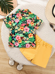 Baby boys' tropical print shirt and yellow shorts set with bow tie detail.