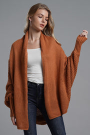 Brick acrylic batwing cardigan with draped front and textured sleeves.