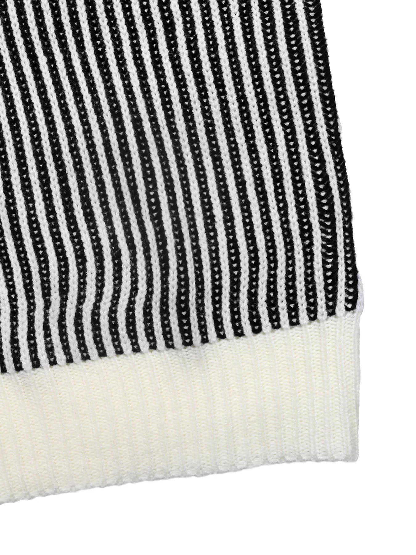 Black and white striped knit sweater with a contrast ribbed hem.