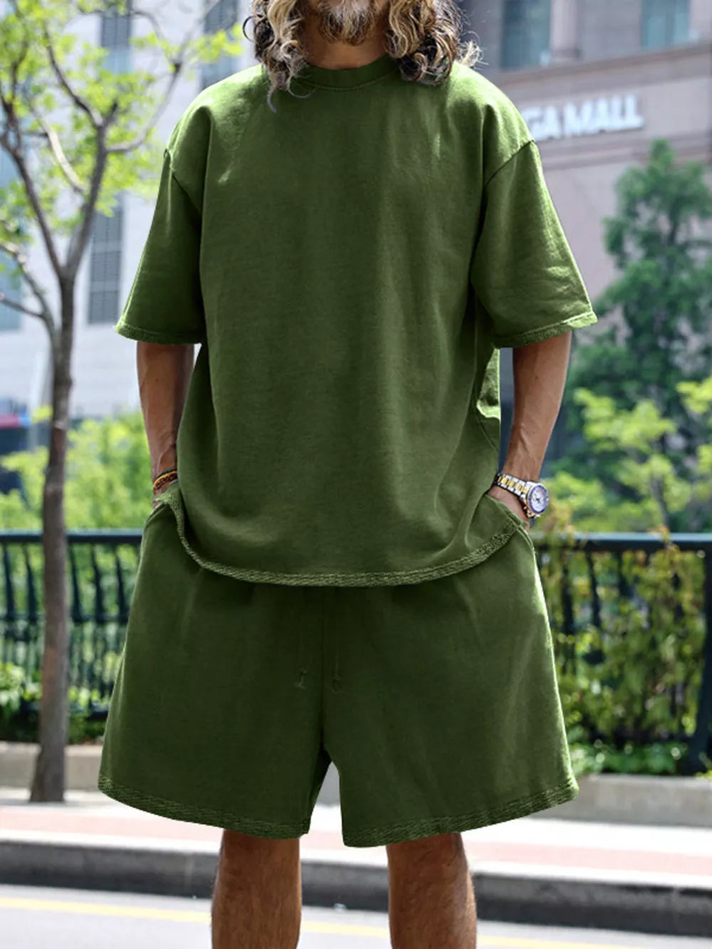 Men's relaxed fit two-piece set in Army Green, featuring a crew neck tee and drawstring shorts.