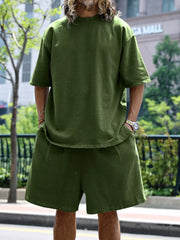 Men's relaxed fit two-piece set in Army Green, featuring a crew neck tee and drawstring shorts.