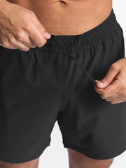 Black performance drawstring running shorts with elastic waistband detail.