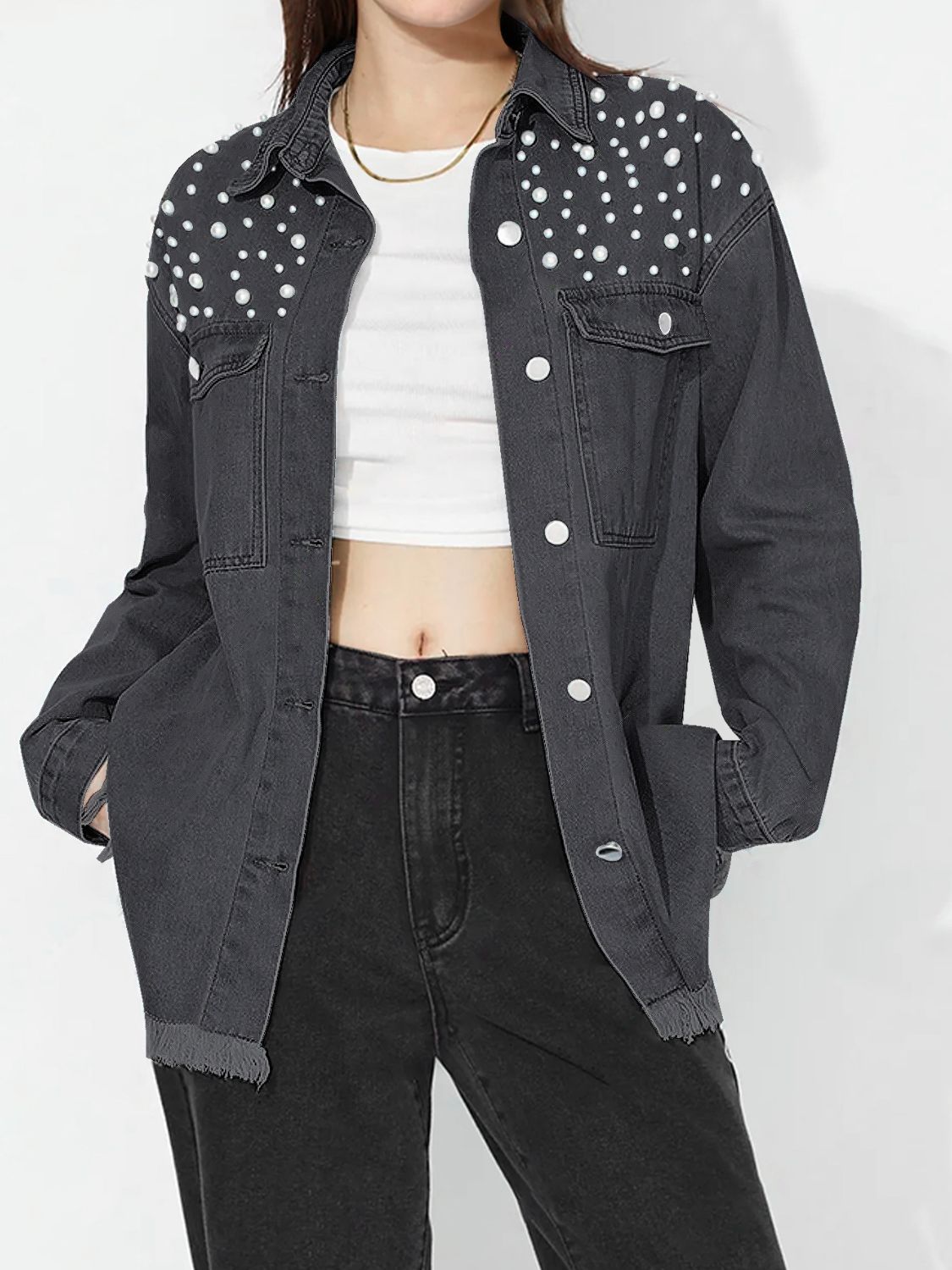 Dark denim shirt with pearl embellishments on shoulders, frayed hem, and button front.
