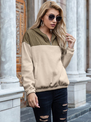 Quilted shoulder block fleece hoodie in khaki and beige with a quarter zip and kangaroo pocket.