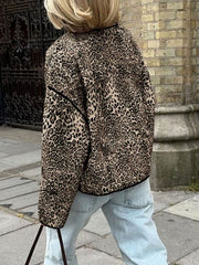 Leopard print boxy jacket with black edge trim, worn by a woman in light wash jeans.