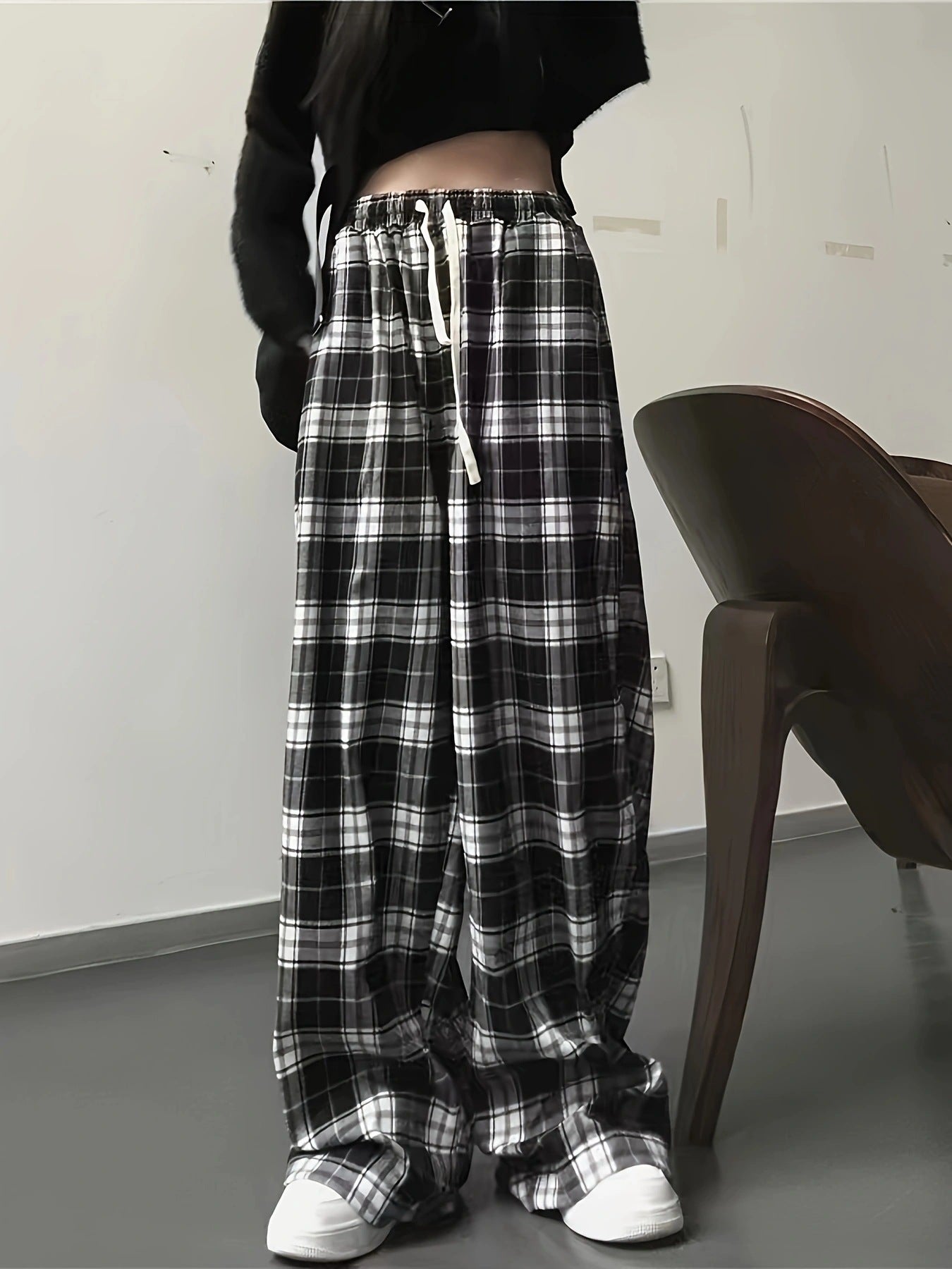 High waist wide leg plaid pants with drawstring in black and white cotton.