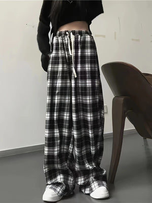 High waist wide leg plaid pants with drawstring in black and white cotton.