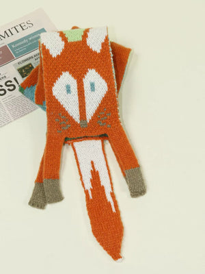 Chunky knit orange scarf with a white and blue fox face design and a white tail.