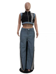 Chic zip-front crop top and wide-leg jeans set with side stripes.