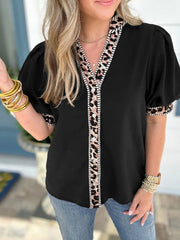 Black puff sleeve blouse with leopard trim and button front.