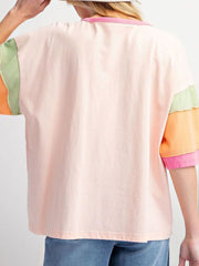 Colorblock tee with pink, orange, green, and watermelon pink sleeves and neckline.