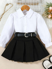 Toddler white collared long sleeve shirt with black pleated skirt and belt