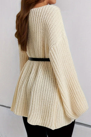 Cream ribbed knit belted mini dress with boat neck and oversized sleeves.