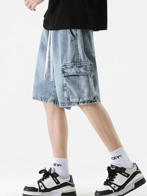 Light wash denim cargo shorts with drawstring and flap pocket.