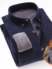 Navy corduroy button-down shirt with sherpa lining and button cuffs.