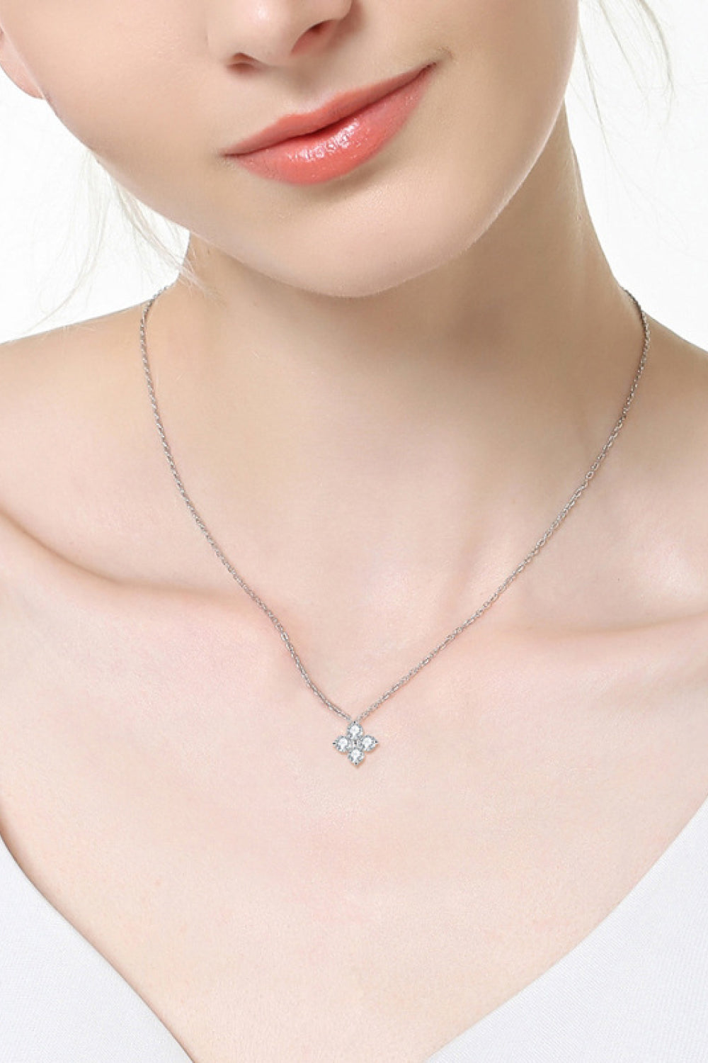 Silver four-petal diamond blossom necklace on a delicate chain, made of 925 sterling silver.