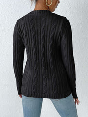 Black cable knit sweater with crew neck and long sleeves.