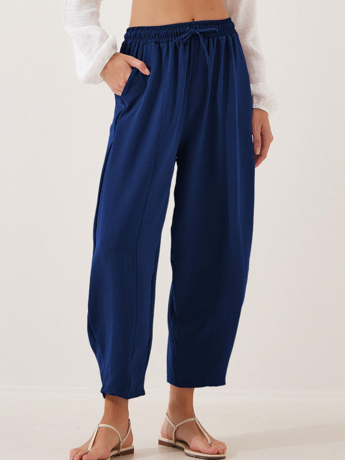 Balloon-leg drawstring trousers in Air Force Blue with seam detail and pockets.