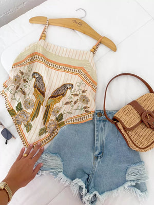 Tropical parrot print cami top with beaded straps and a bandana hem.
