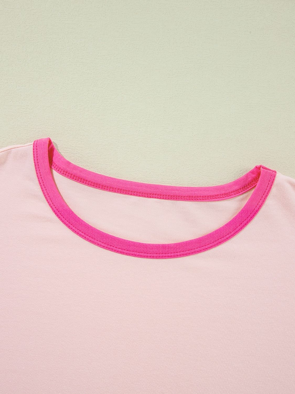 Colorblock vacay graphic tee in watermelon pink with contrast neckline trim.