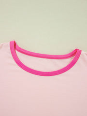 Colorblock vacay graphic tee in watermelon pink with contrast neckline trim.