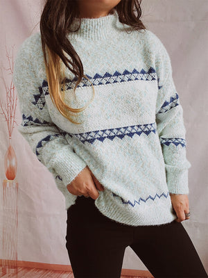 Geometric knit mockneck pullover in Misty Blue with blue fair isle pattern, acrylic blend.