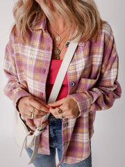 Oversized pink plaid shacket with button-down front and chest pocket.