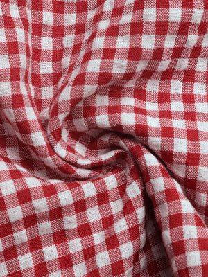 Gingham tie-front bustier top in deep red and white checkered fabric.