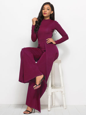Wine high-waisted palazzo jumpsuit with slit front and long sleeves.