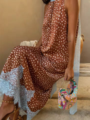 Brown polka dot maxi skirt with light blue lace trim and high neckline top.