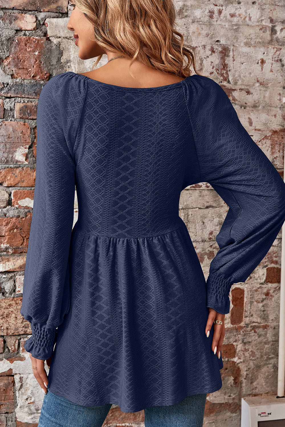 Dark blue textured blouse with shirred sleeves and empire waist