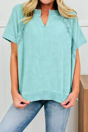 Distressed cotton tee with notched V-neck and lace insets.
