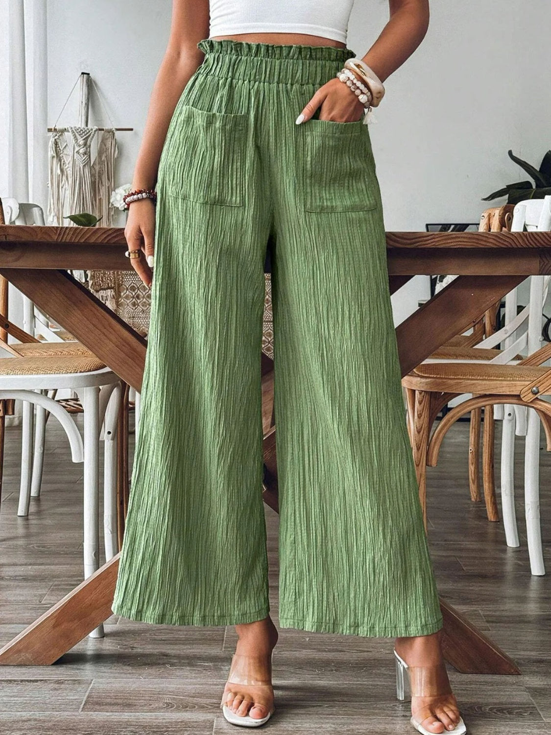 Textured wide-leg palazzo trousers in Matcha Green with elastic waist and front pockets.